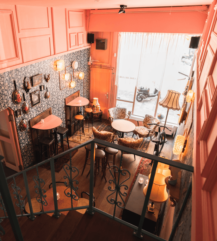 Cozy café with small tables and comfortable chairs.